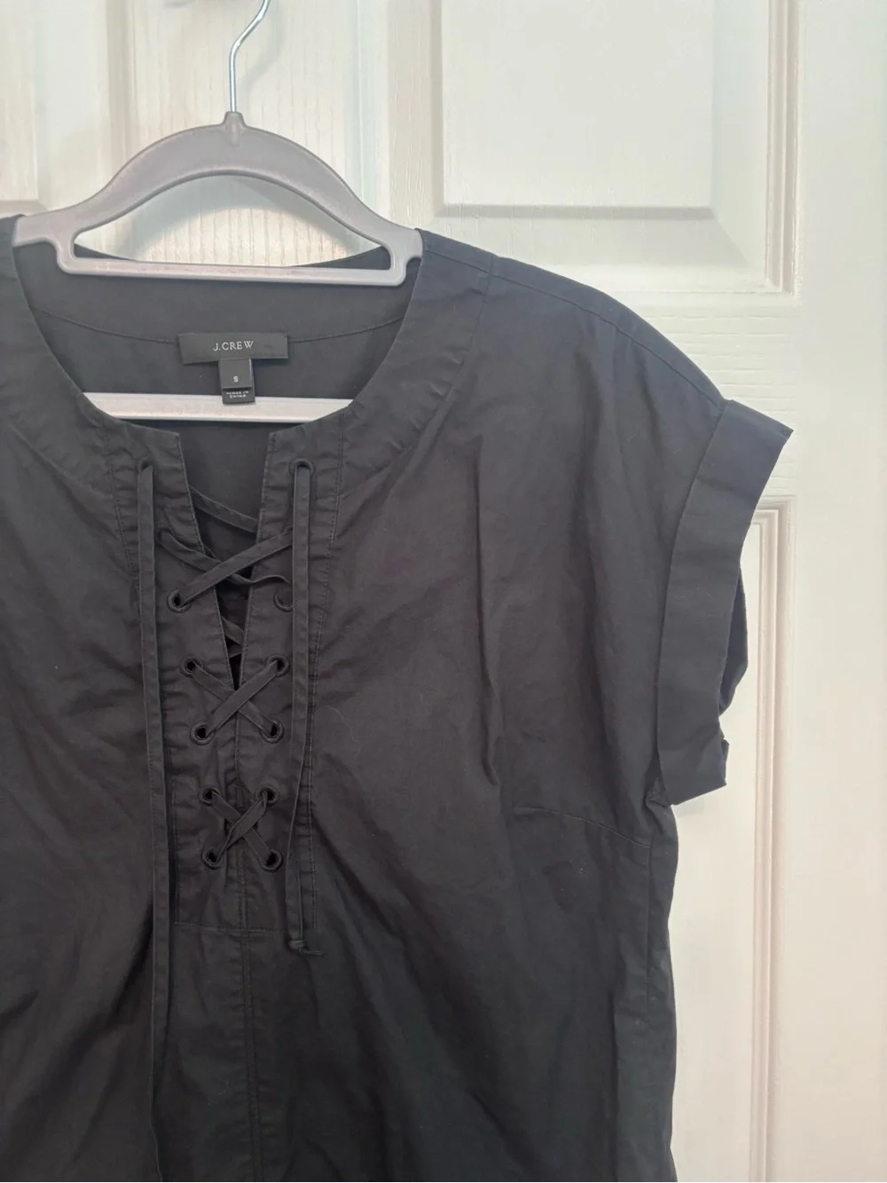 J Crew black short sleeved lace up dress.